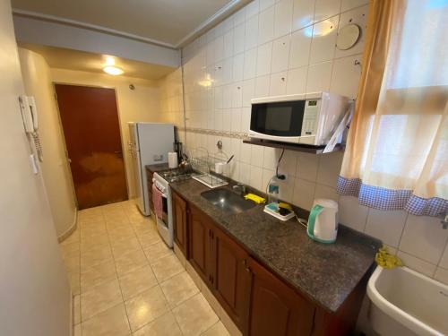 O bucătărie sau chicinetă la Junin Centro Apartament