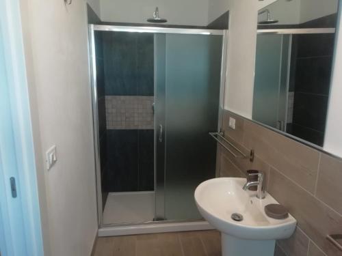 a bathroom with a glass shower and a sink at Agriturismo La Costa dei Trabocchi in Torino di Sangro