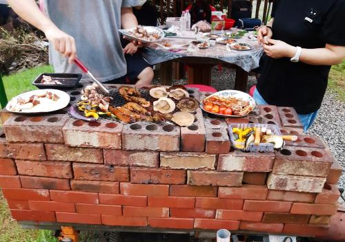 a barbecue made out of a brick wall at Heidi Korea in Hongcheon