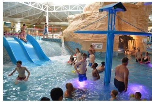 a group of people in a pool at a water park at Cosy caravans Sandhills 175 butlins Skegness resort in Ingoldmells