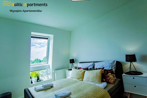 Postel nebo postele na pokoji v ubytování Baltic Apartments - Apartamenty Bałtyk Bay View