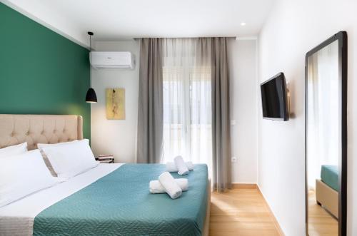 Posteľ alebo postele v izbe v ubytovaní Central Green Apartment