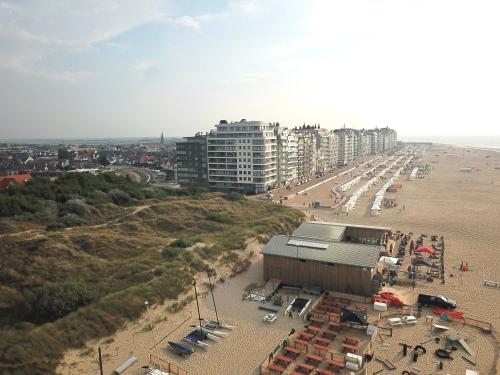 an aerial view of a beach with buildings and condos at Residentie Hermes in Wenduine