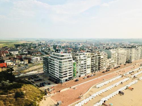 an aerial view of a beach and buildings at Residentie Hermes in Wenduine