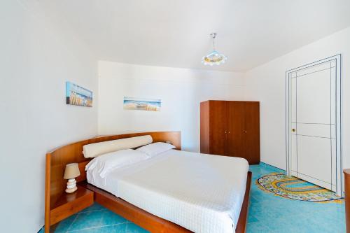 Ένα ή περισσότερα κρεβάτια σε δωμάτιο στο Ravello Art Apartments