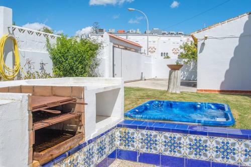 a swimming pool in the backyard of a house at Villa Marina Benalmadena - 5 min walk to the beach, heated pool, spa, 5 bedrooms in Benalmádena