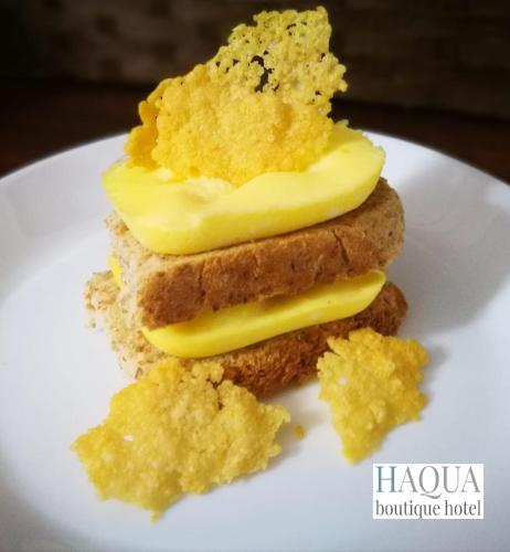 a sandwich with butter on a plate with crumbs at Aqua Boutique Hotel in Castiglione della Pescaia