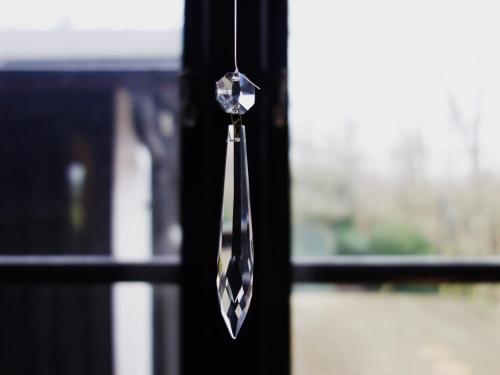 a metal doorwig hanging from a window at Vikens bed and Breakfast in Viken