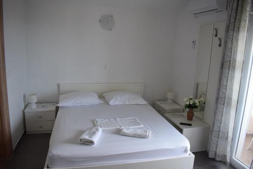 Postel nebo postele na pokoji v ubytování Apartmani Katica