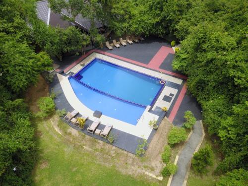 an overhead view of a swimming pool in a yard at Nice Place Resort in Dambulla