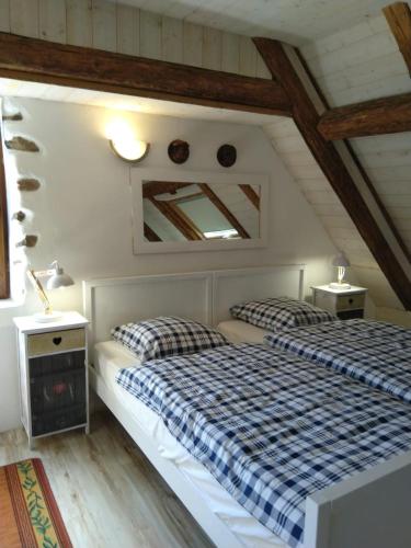 a bedroom with two beds in a attic at Vogesenparadies in Kirchberg