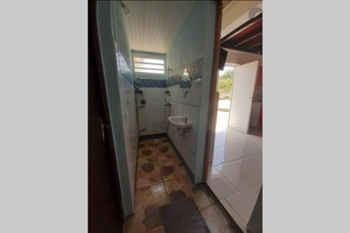 a bathroom with a sink and a toilet in it at La Kaz d'Évania in Sainte-Rose
