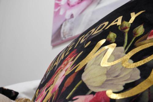 a close up of a vase with a flower on it at Orion Eco Suites in Karteros