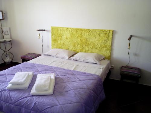 מיטה או מיטות בחדר ב-Monte do Rio-Pêra