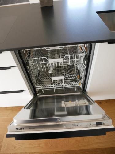 a dishwasher with its door open on a counter at Penthouse 37th HEAVEN (ca. 90m²) in Lochau