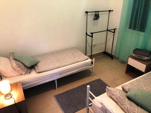 a small room with a bed and a table at Villa SCIROCCO Madeira - Ocean View in Machico