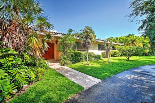 a house with palm trees and a driveway at 7545 Southwest 124th Street in Miami