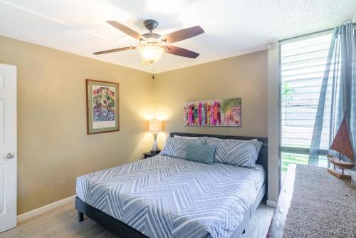 a bedroom with a bed and a ceiling fan at Maui Vista - Kihei Kai Nani Beach Condos in Kihei