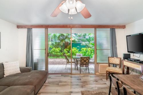 a living room with a couch and a ceiling fan at Amazing Kihei Kai Nani - Maui Vista One Bedroom Condos in Kihei