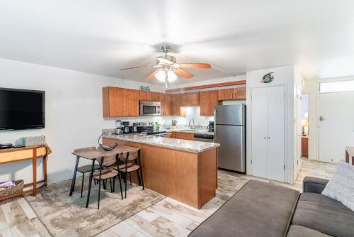 a kitchen and living room with a couch and a table at Amazing Kihei Kai Nani - Maui Vista One Bedroom Condos in Kihei
