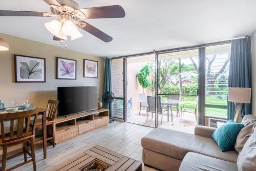 a living room with a couch and a tv at Amazing Kihei Kai Nani - Maui Vista One Bedroom Condos in Kihei