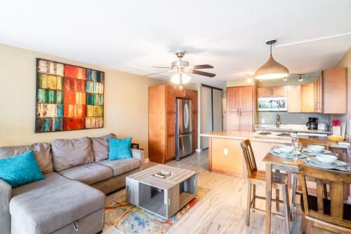a living room with a couch and a kitchen at Amazing Kihei Kai Nani - Maui Vista One Bedroom Condos in Kihei