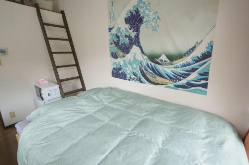 Garden house Ozasa - Apartment STAYにあるベッド