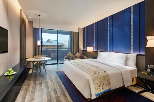 Säng eller sängar i ett rum på Wanda Realm Resort Nanning