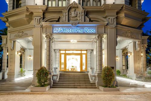 a building with a sign that reads as hotel plutourse at AVS Hotel Phu Quoc in Phu Quoc