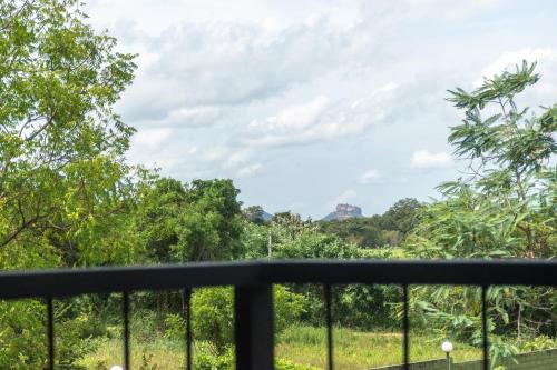 a view of the jungle from a balcony at Nice Place Resort in Dambulla