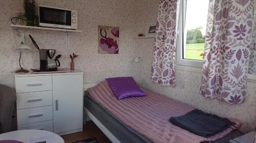 Tempat tidur dalam kamar di Borängs Gård