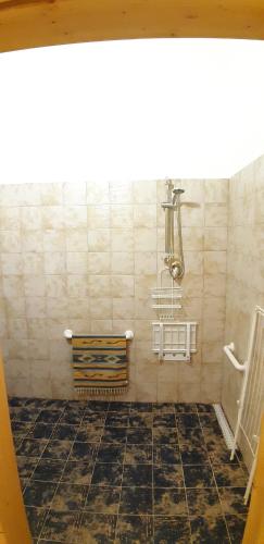 a bathroom with a bench and a tiled floor at Case Vacanze "Residenze Trapanesi" in Trapani