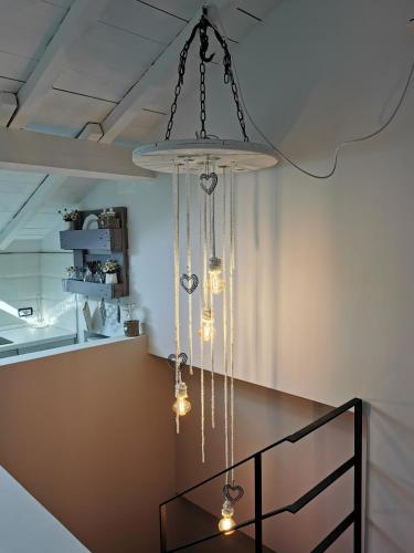 a chandelier hanging from a ceiling in a room at Tuffonelblu in Ventimiglia