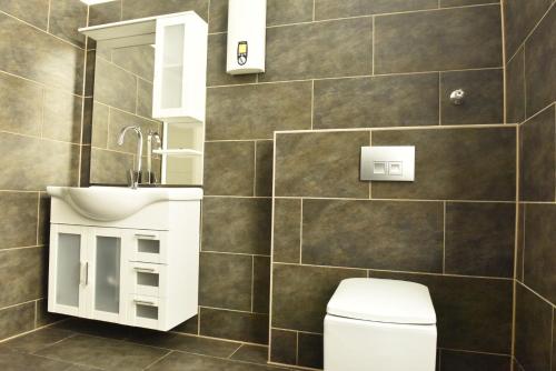 a bathroom with a toilet and a sink at Fewo Wuppertal in Wuppertal