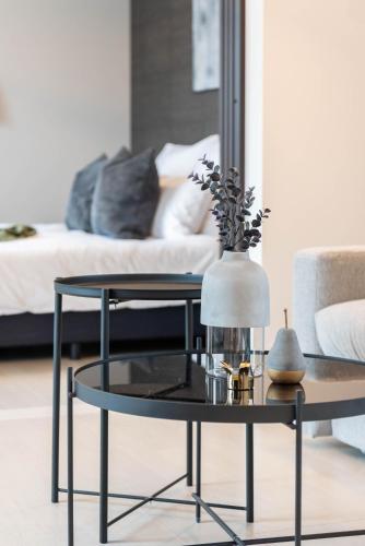 a coffee table in a living room with a couch at Bijou Suites Vivre in Osaka