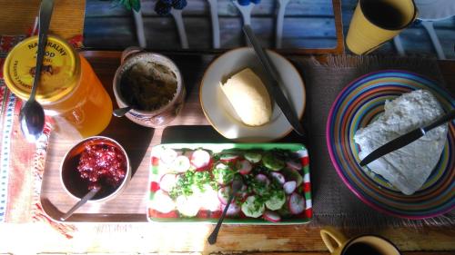a table with a plate of food and a bowl of food at Organistowka in Bircza