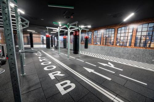 an empty subway station at night with a bus stop at Allure Healthy Hotel & Spa in Eger