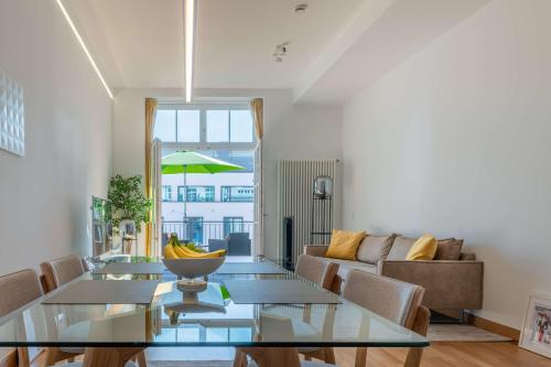 a living room with a table and a couch at Schwarzwald Loft in Baden-Baden