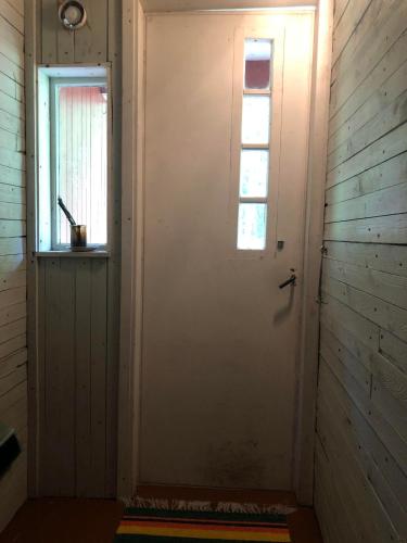 a door in a room with a window at KTU Kuntomaja in Kokkola