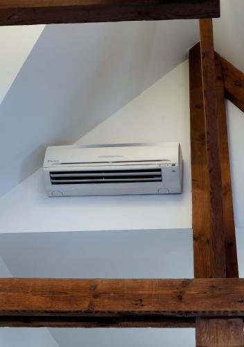 a air conditioner sitting on top of a ceiling at Apartments Ypres in Ypres