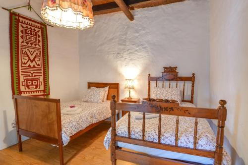 Postel nebo postele na pokoji v ubytování Casa Rural Tamia