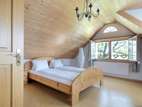 Säng eller sängar i ett rum på Alpenheim