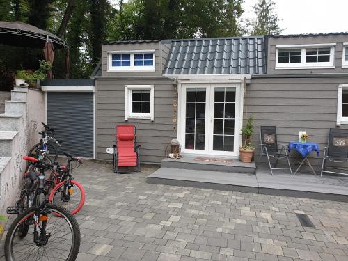 a house with a bike parked in front of it at Tinyhaus Wolkenlos Familie Hamdorf in Bad Sulza