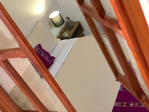 a room with a bunk bed and a table at Hotel Casa Azabache in San Cristóbal de Las Casas