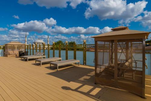 a deck with benches and a gazebo next to the water at Wyndham Istanbul Old City in Istanbul