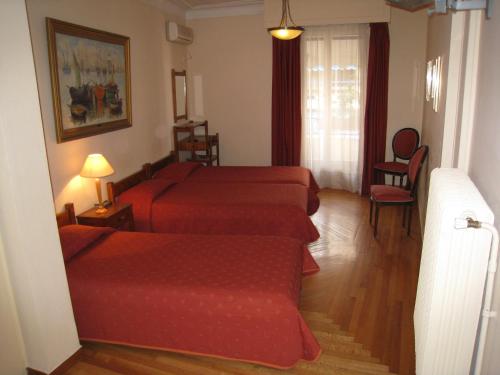 Postel nebo postele na pokoji v ubytování Art Gallery Hotel