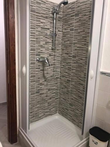 a shower with a glass door in a bathroom at SAN LEONARDO in Cariati