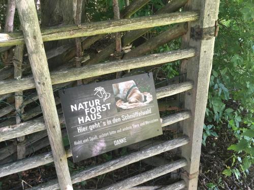 a sign on a fence with a sign that says mtn trust has a dog at Naturforsthaus Eddas Zimmer für Hunde - und naturverbundene Menschen in Preitenegg