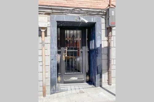 a door to a building with a glass at Town Hall in Bilbao