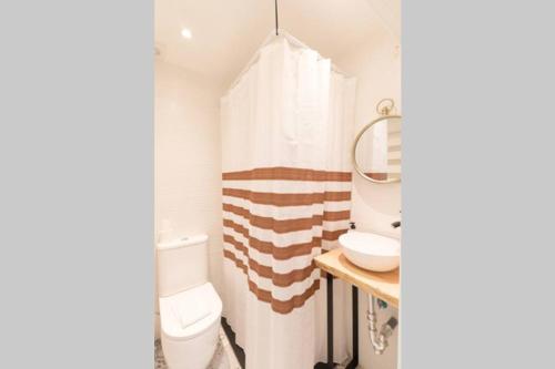 a bathroom with a toilet and a sink at Town Hall in Bilbao